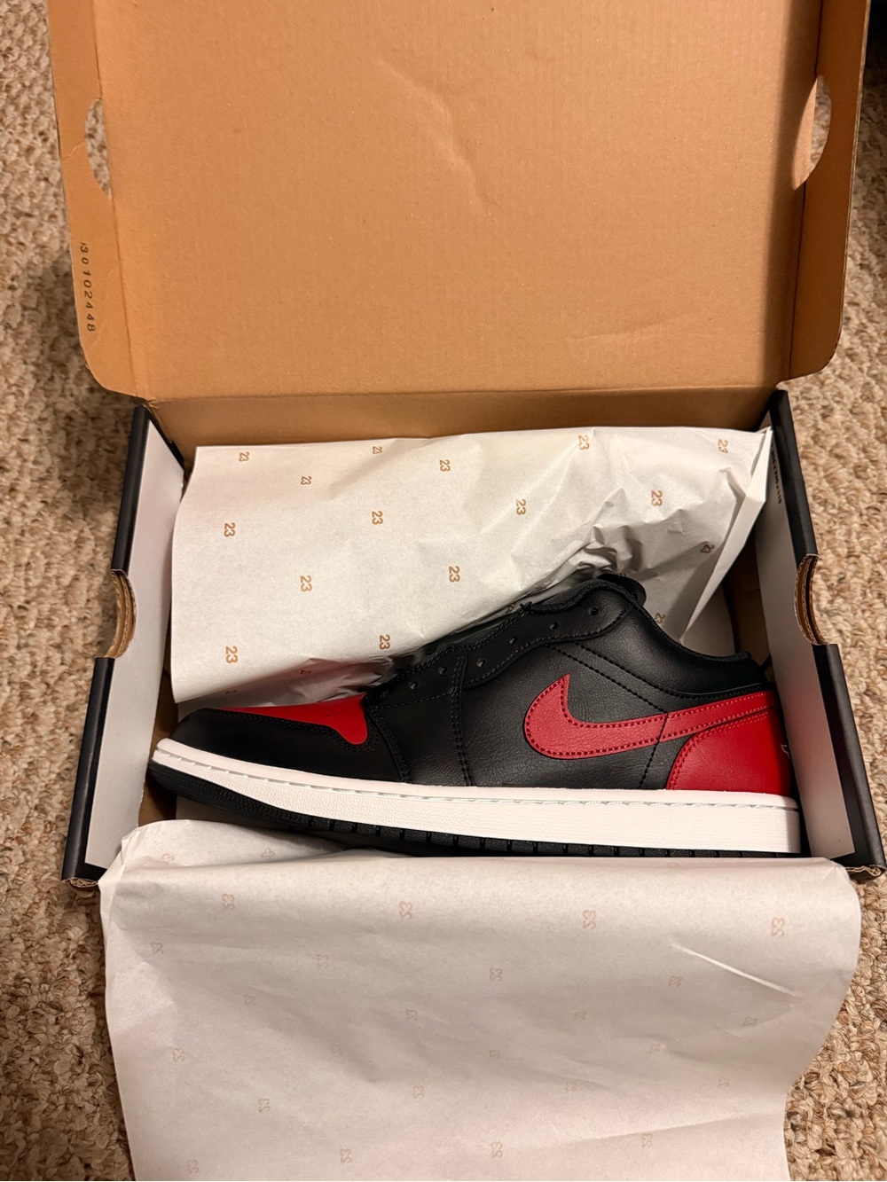 Nike Men’s Jordan Air 1 Black and Red Low-Top Sneakers